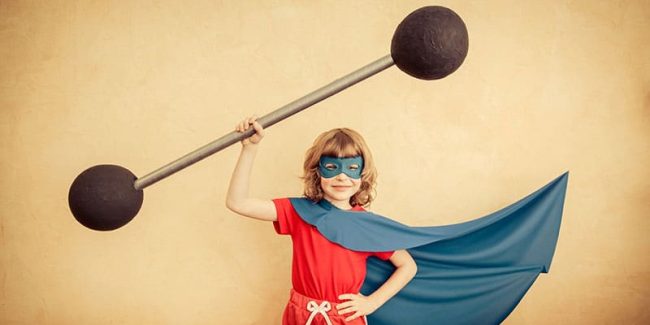 superhero-child-against-grunge-wall-background-kid-holding-barbell-success-winner-concept-800px