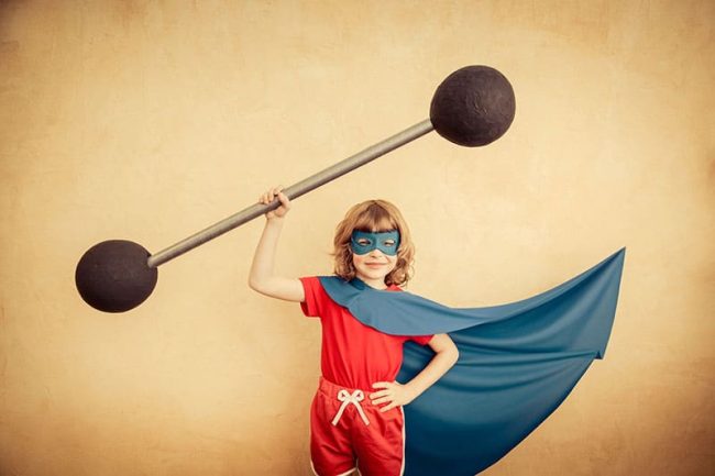 superhero-child-against-grunge-wall-background-kid-holding-barbell-success-winner-concept-800px