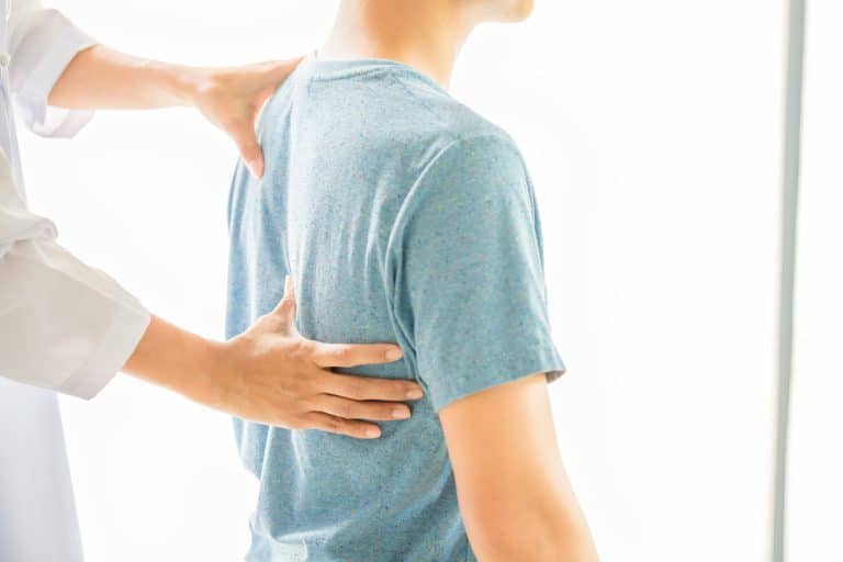 close-up-physiotherapist-working-with-patient-clinic
